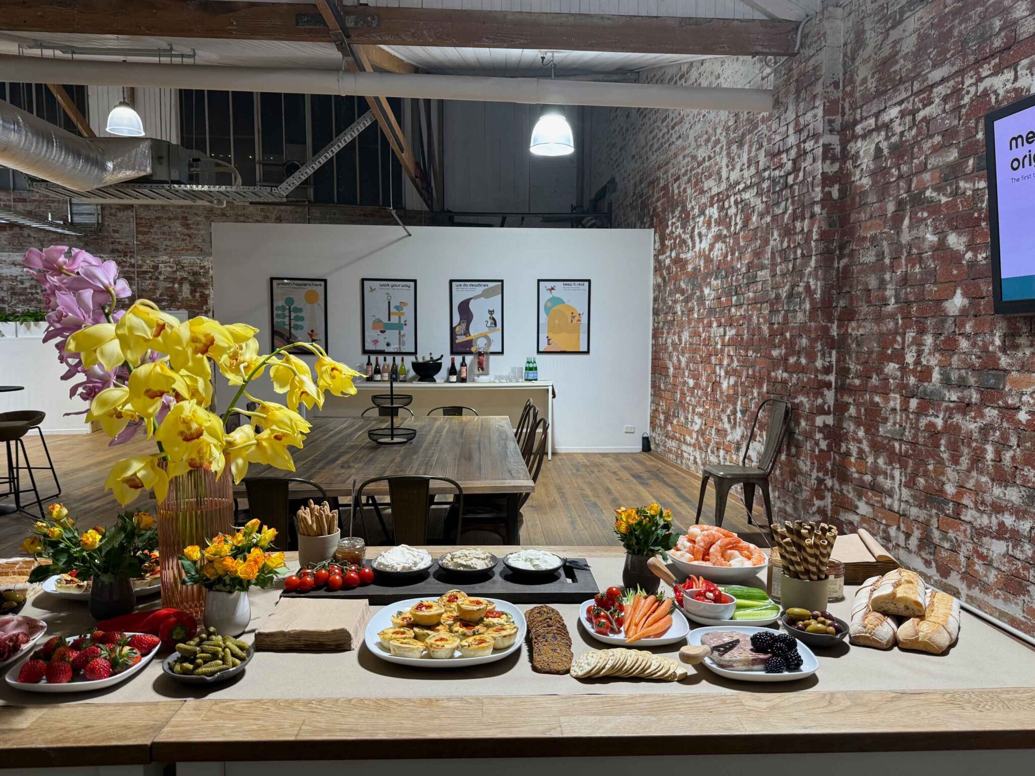 Grazing table at ko&co launch night with digitally illustrated brand artwork in the background